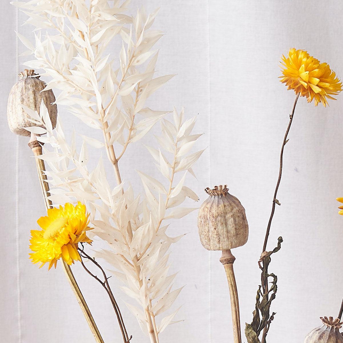 Dried flower bunch with yellow straw and poppy heads